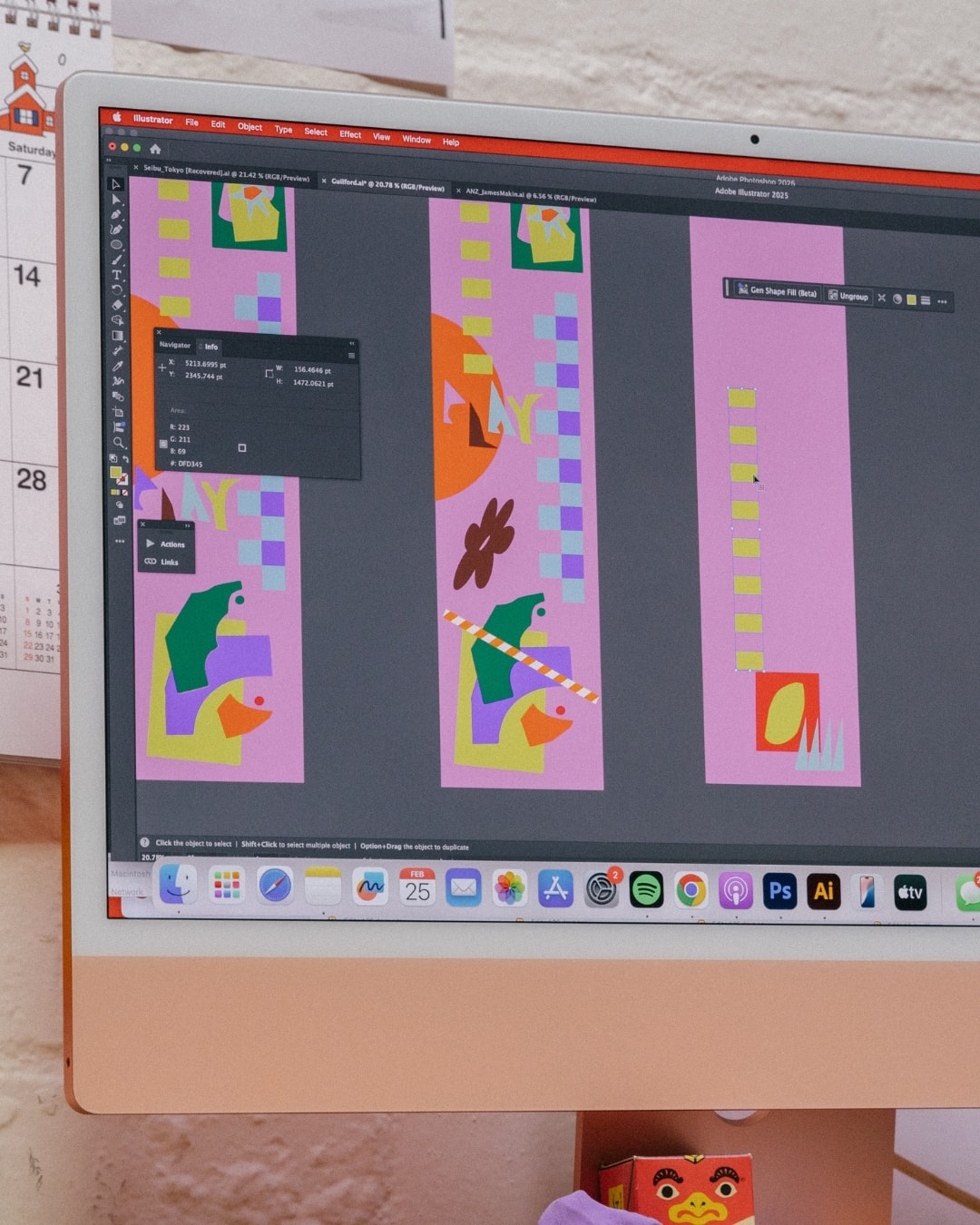 Colourful vertical design panels open on the computer screen in Abbey Rich's studio