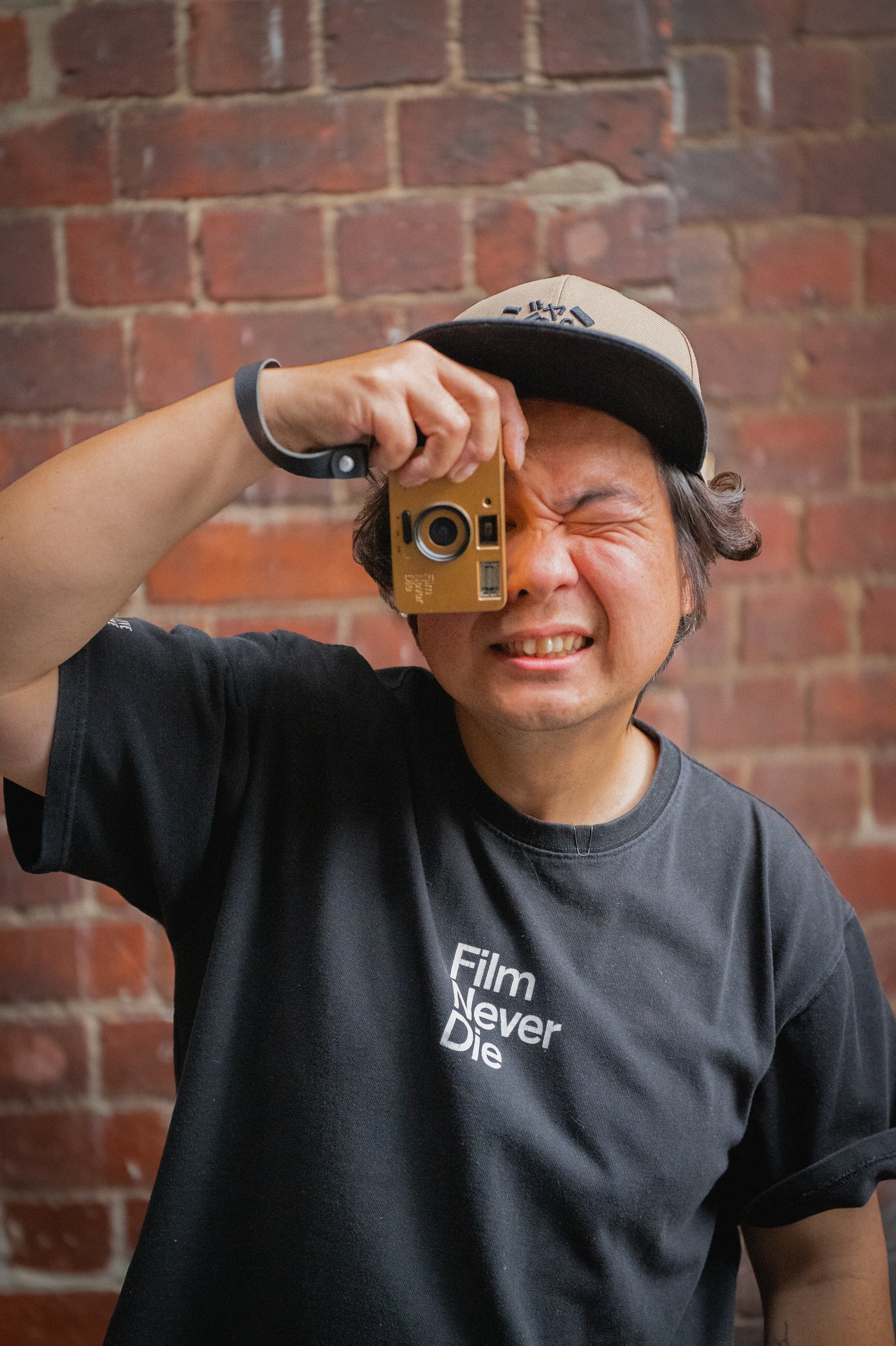 Gary Wong holding a Nana camera to his eye