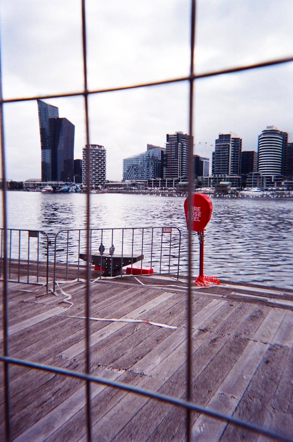 City skyline through a railing, shot on film
