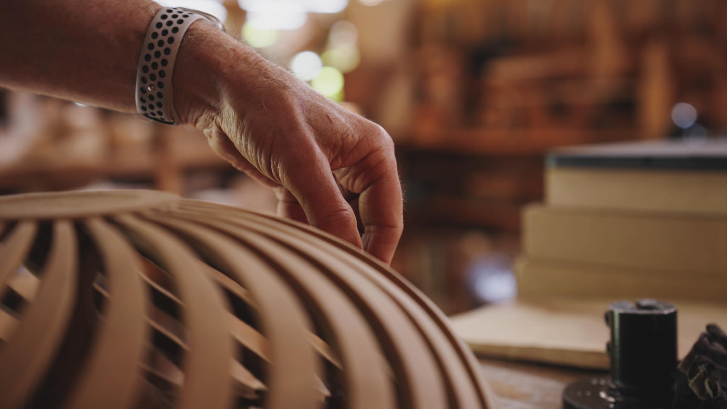 Robert running his fingers along the slats of a bowl