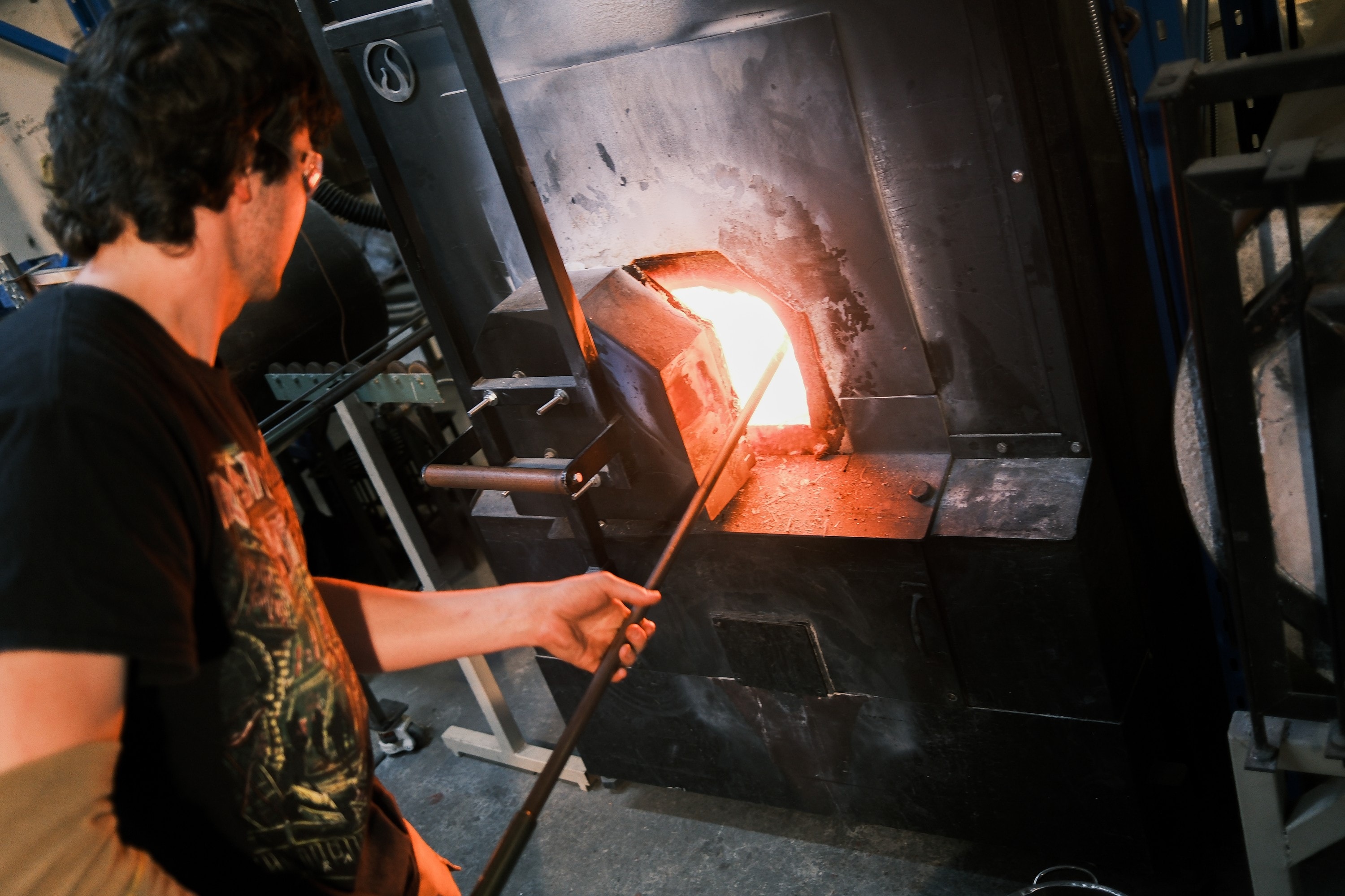 An assistant working at the furnace