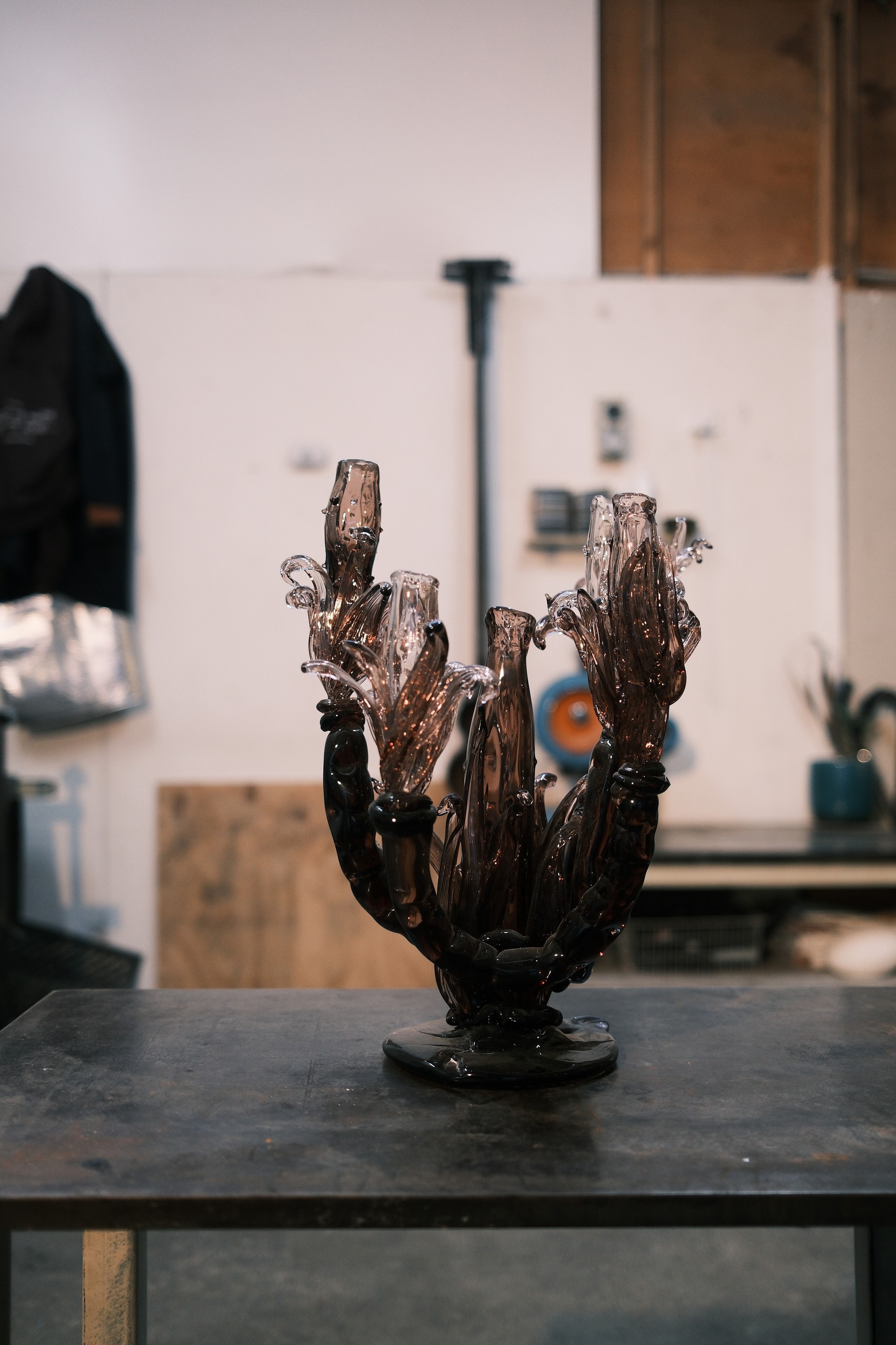 A finished glass piece on the studio table