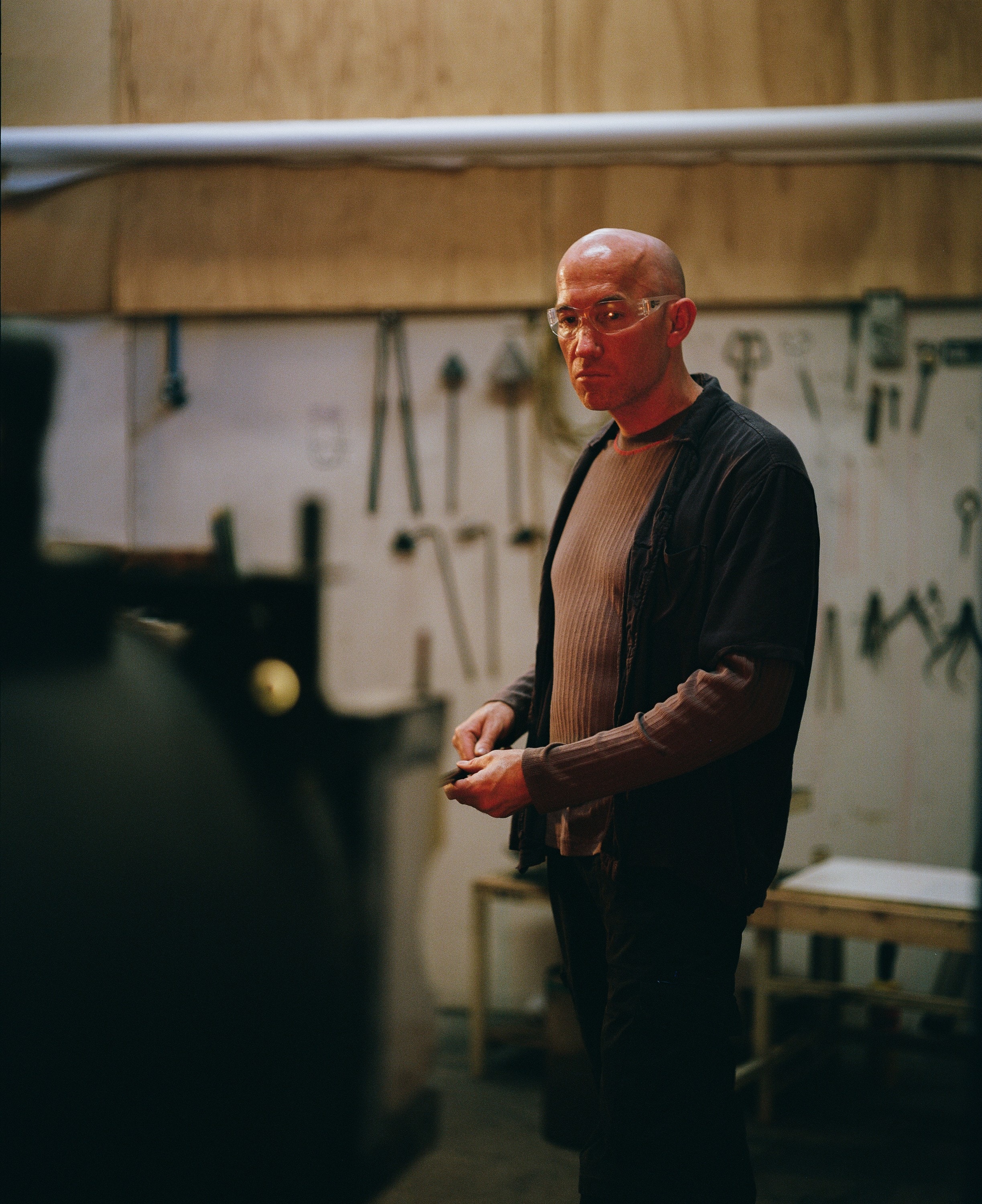 Billy standing in his workshop, shot on film