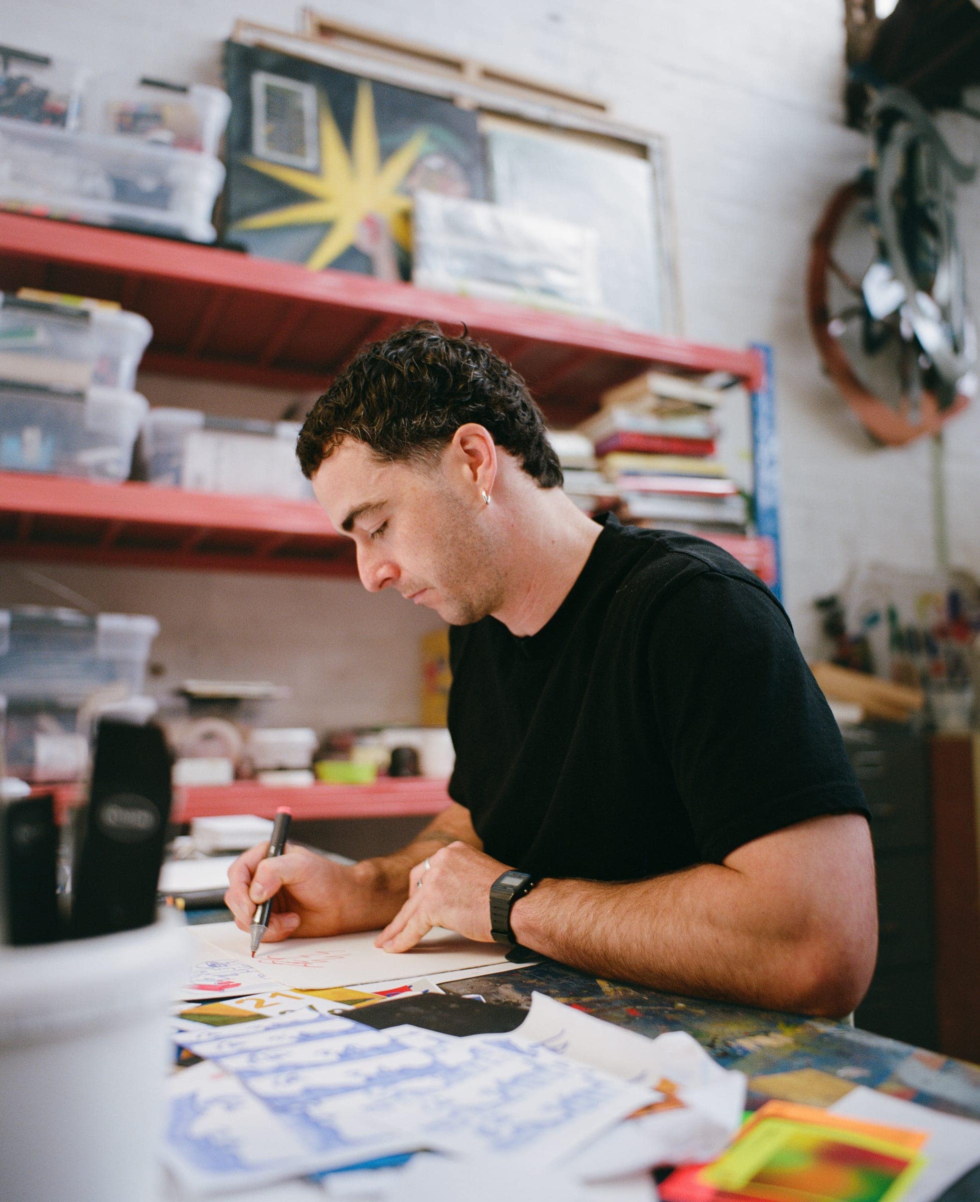 Chris drawing at his desk, shot on film