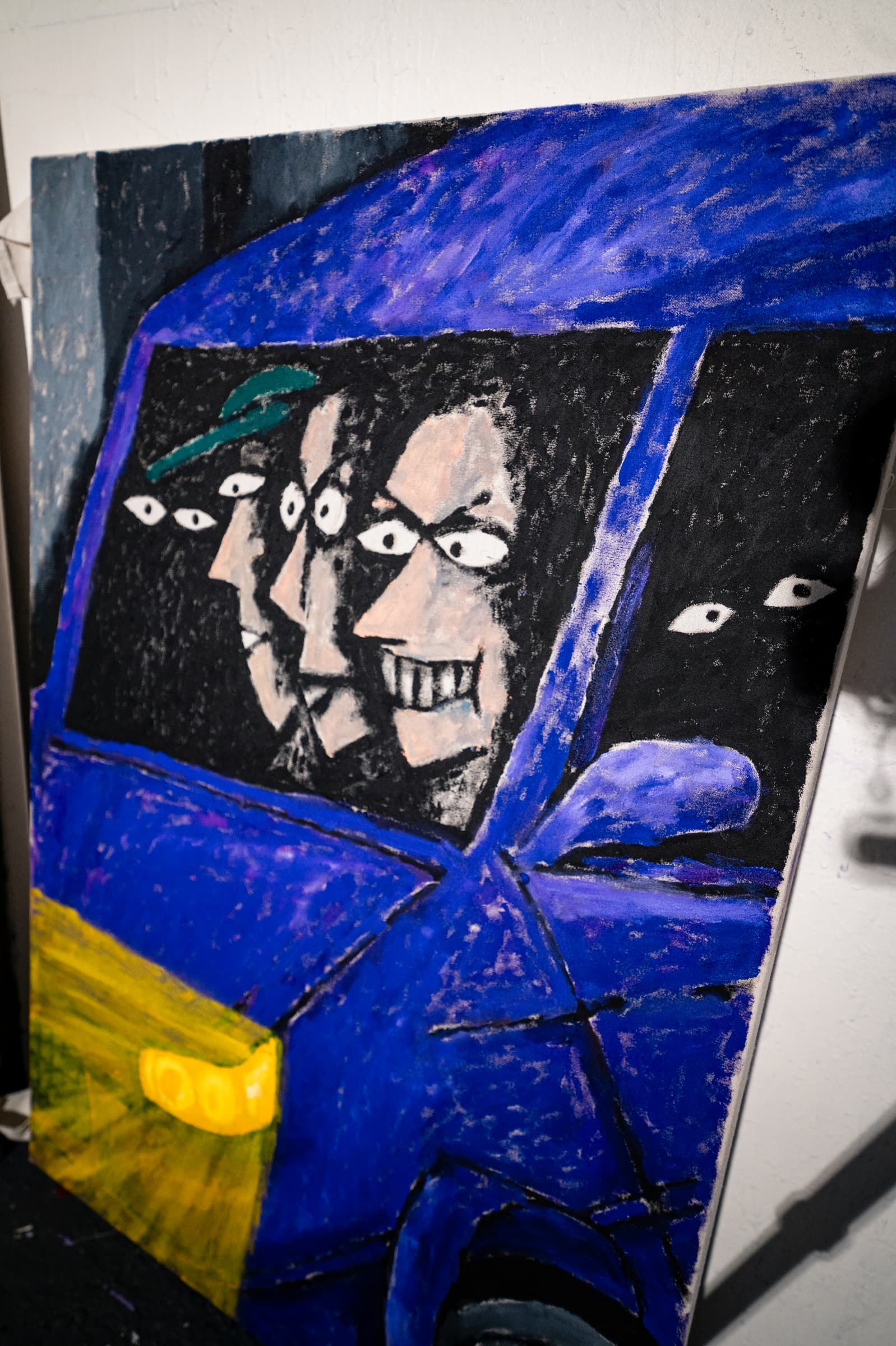 New work: a large car painting in purple enamel, faces looking out through the car window